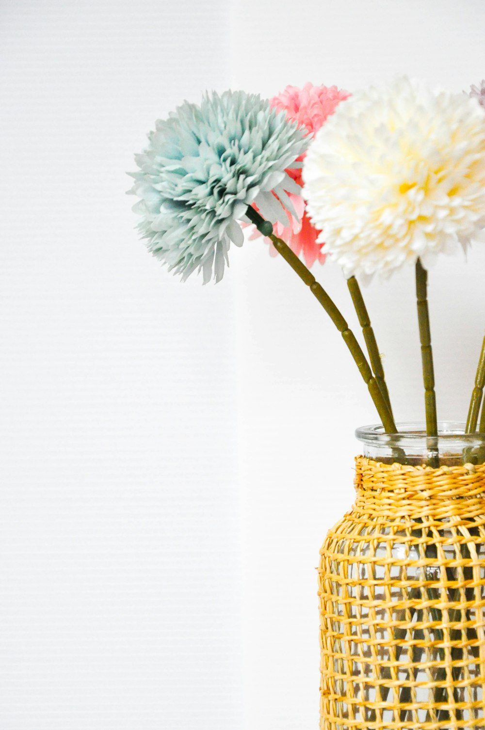 a vase filled with flowers on top of a table