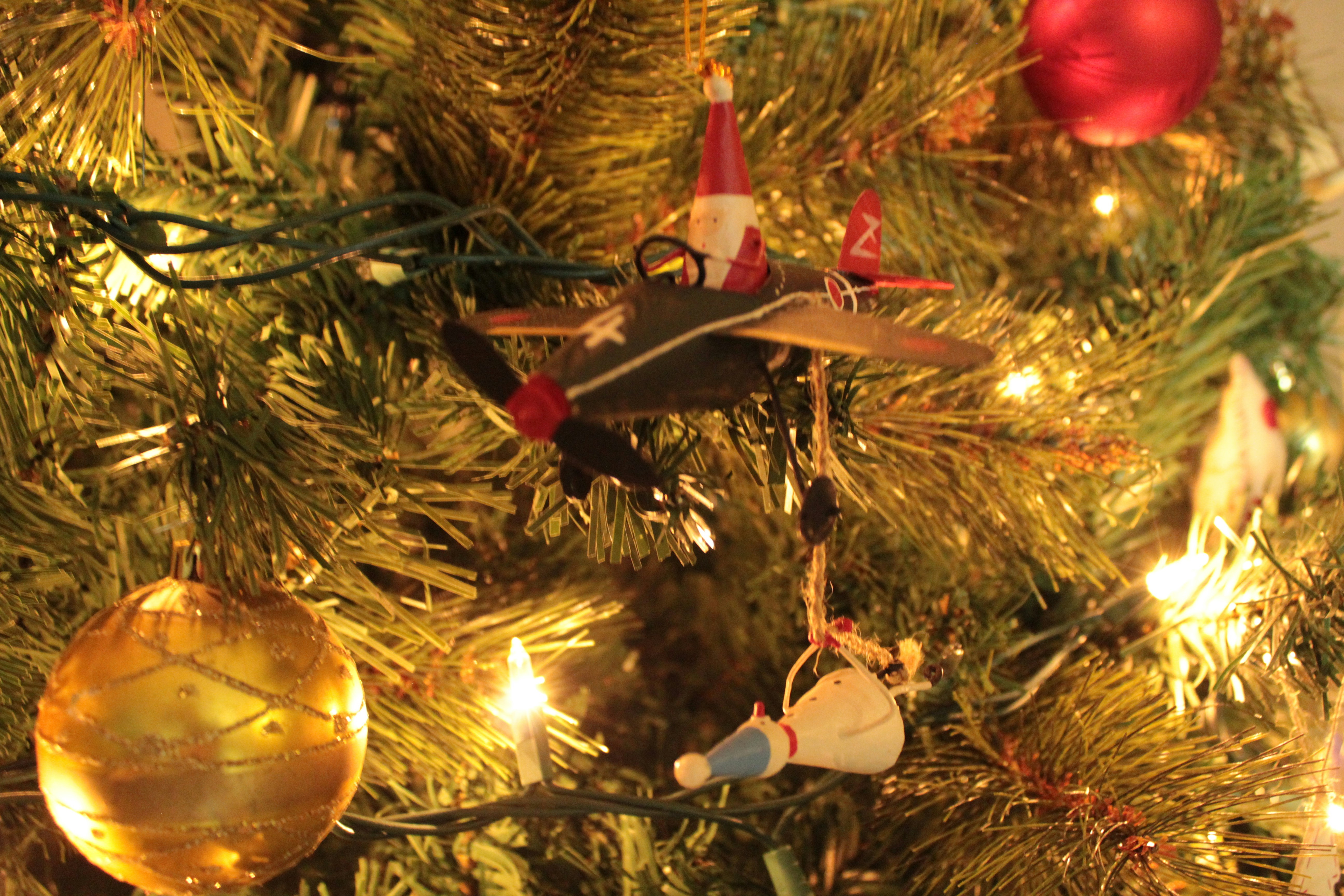 a close up of a christmas tree with ornaments