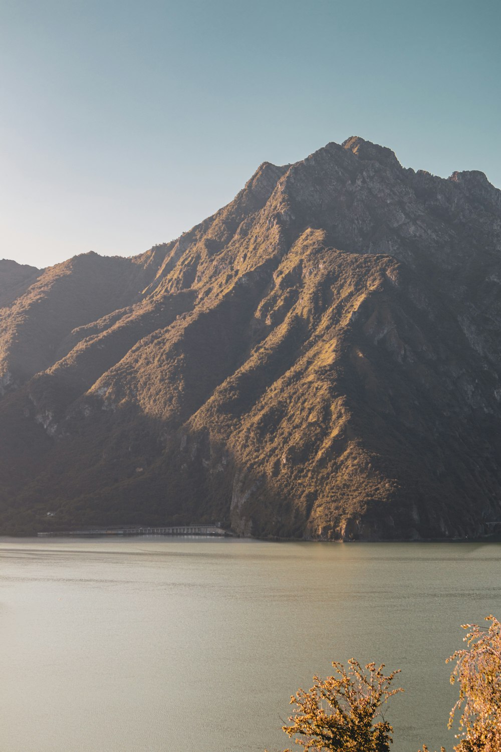 a view of a mountain range with a lake in the foreground