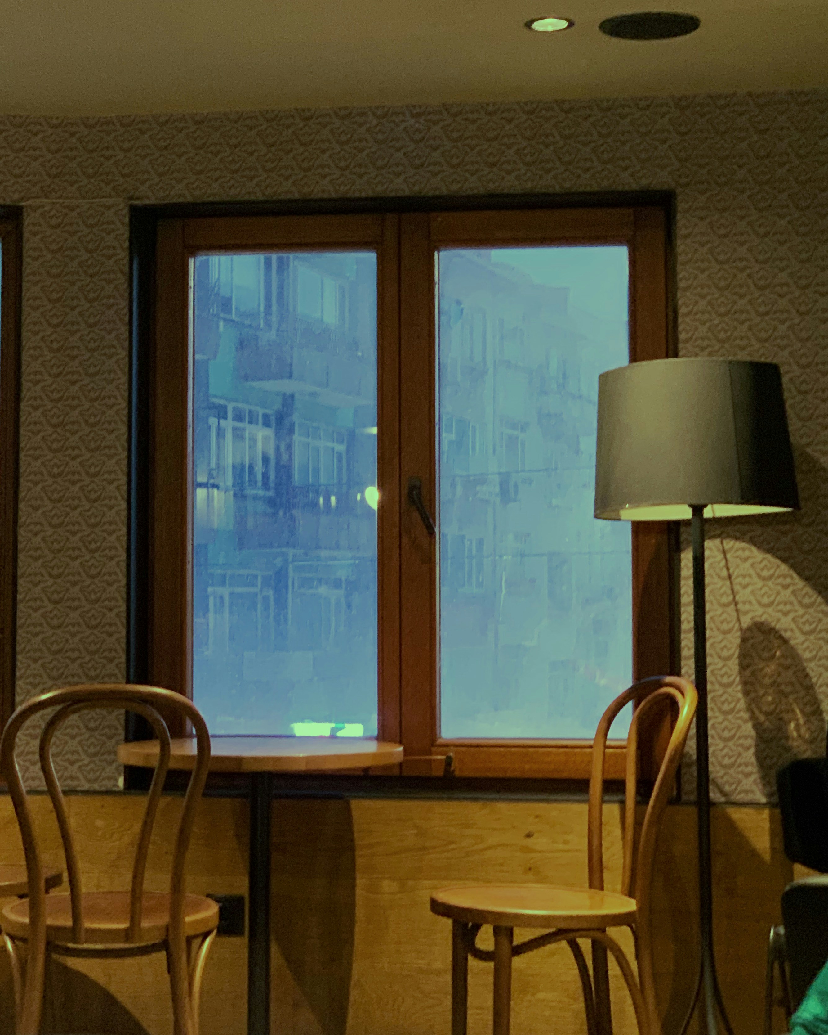 a living room with two chairs and a table