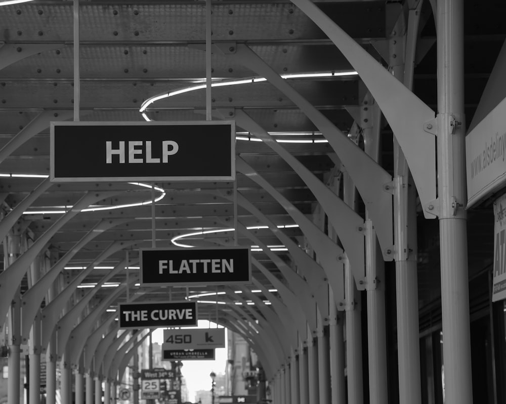 a black and white photo of a train station