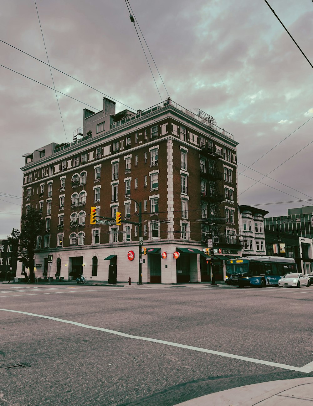 a tall building sitting on the corner of a street