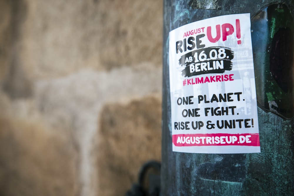 a close up of a sticker on a pole