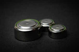 a group of three batteries sitting on top of a table