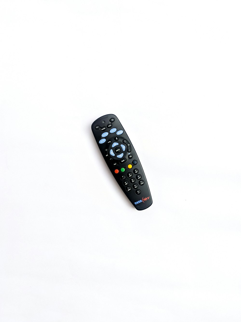 a remote control sitting on top of a white surface