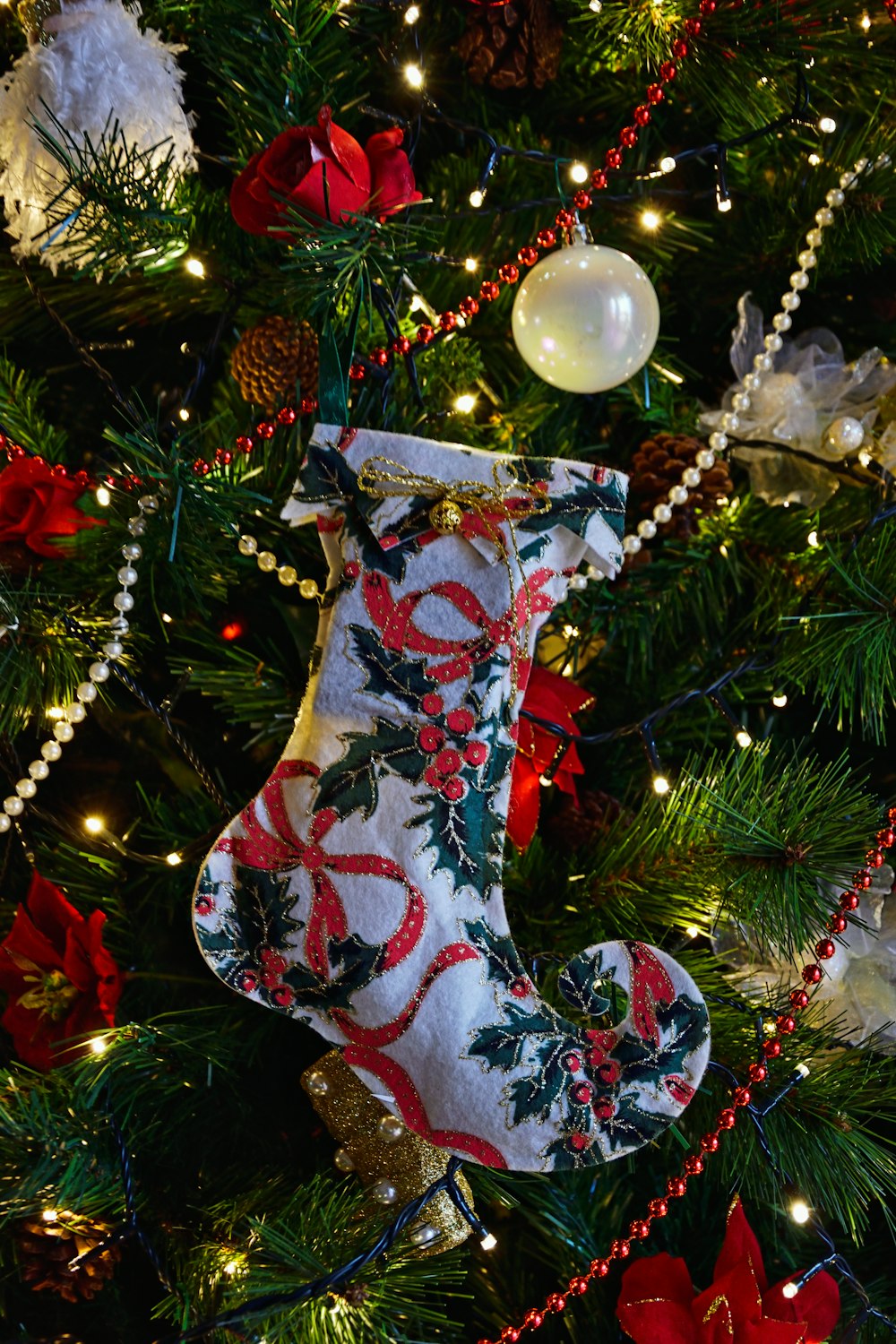 a christmas stocking hanging from a christmas tree