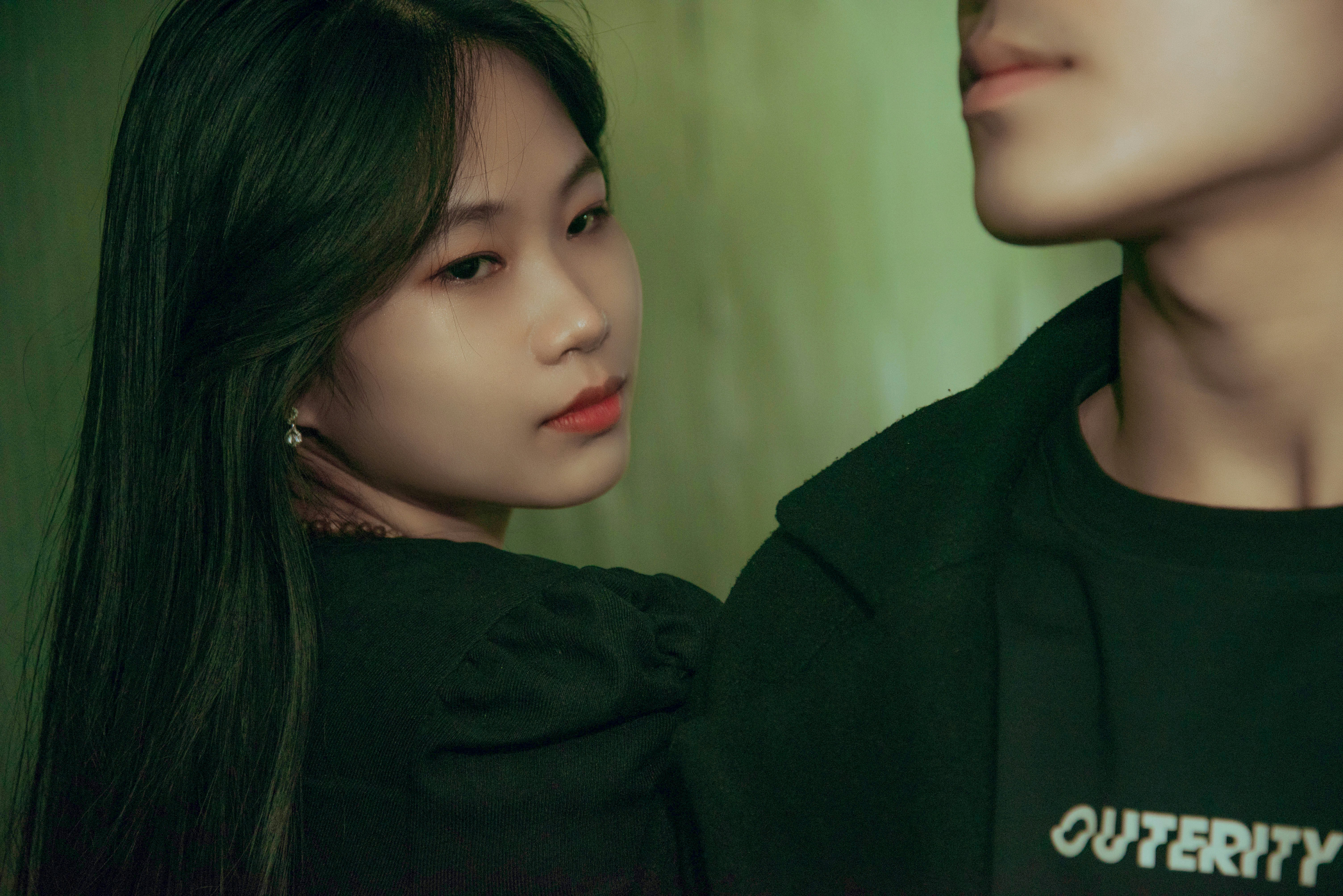 a young asian woman standing next to a young asian man (Photo by Keisha Kim on Unsplash)