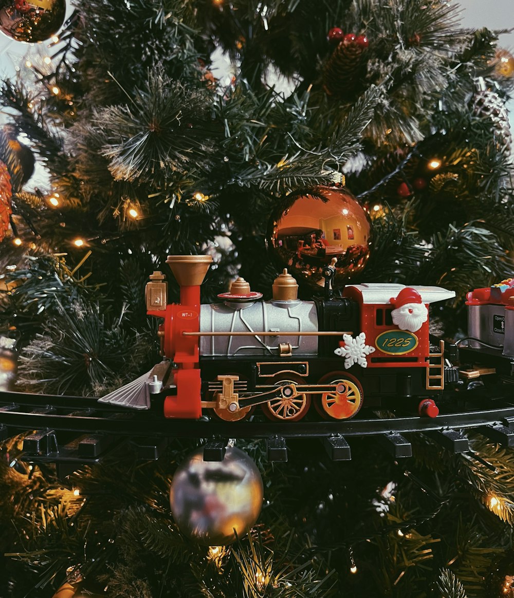 a christmas tree with a train on it