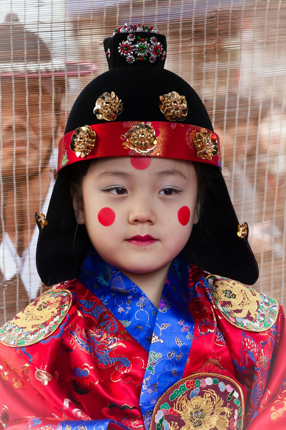 a young child dressed in a traditional chinese costume