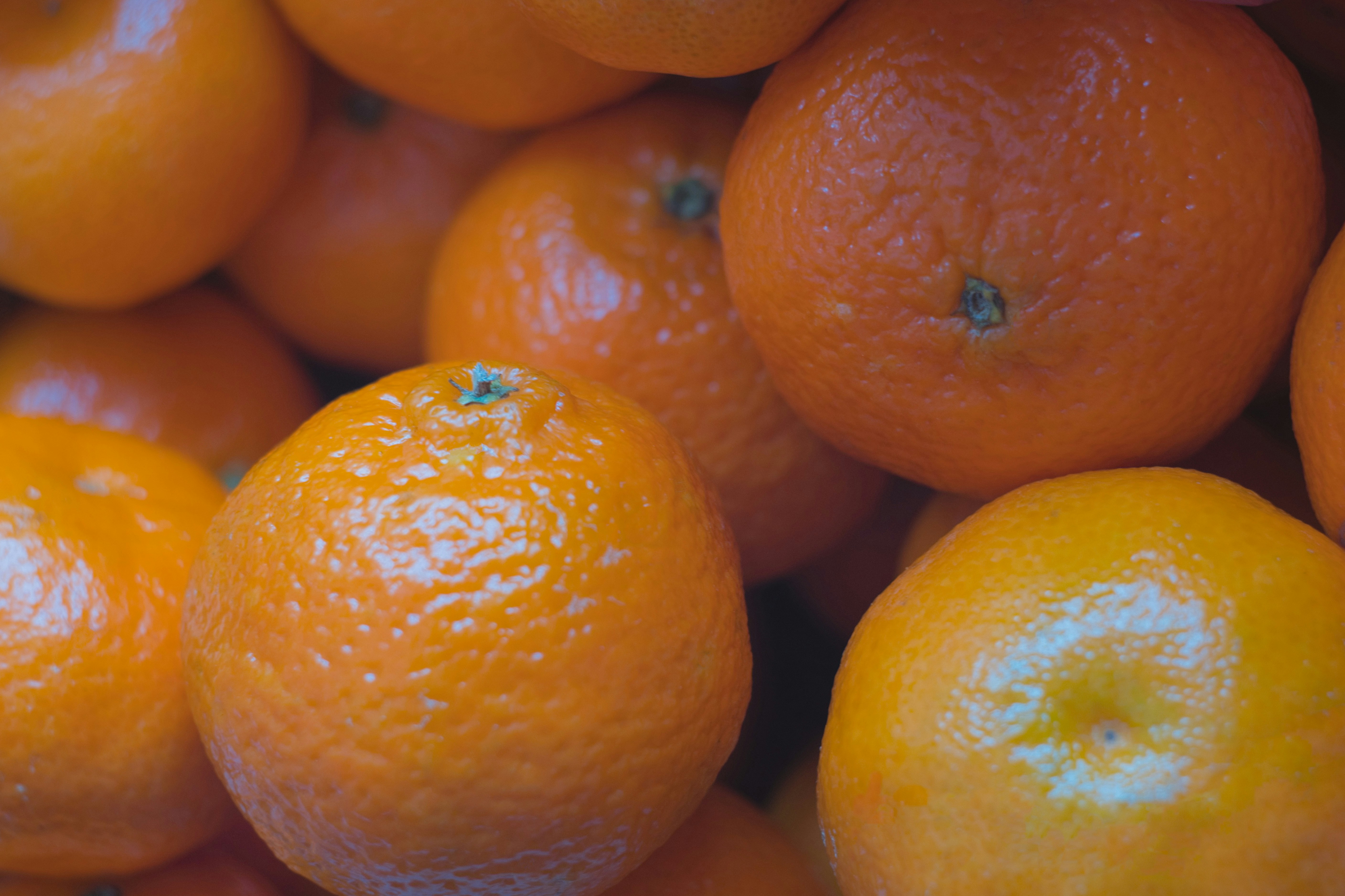 a pile of oranges sitting next to each other
