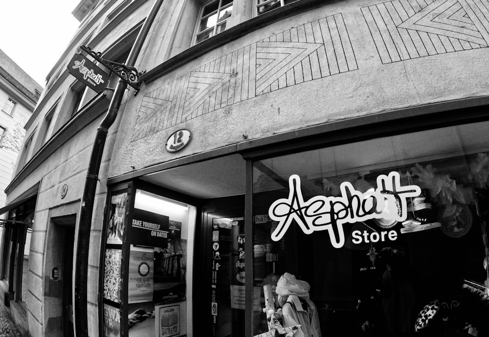 a black and white photo of a store front