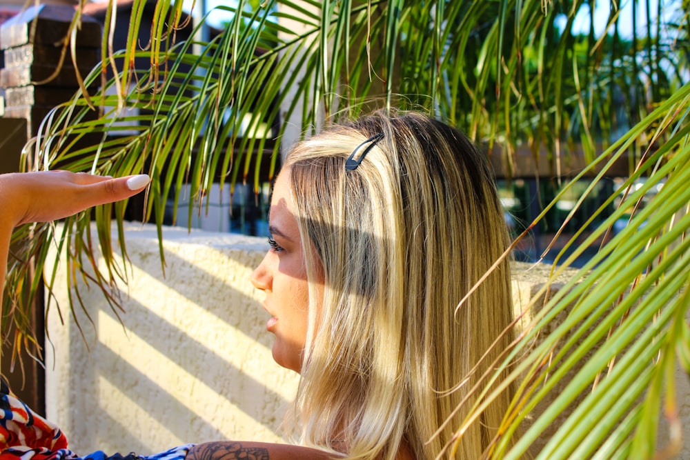 a woman holding a cell phone up to her ear