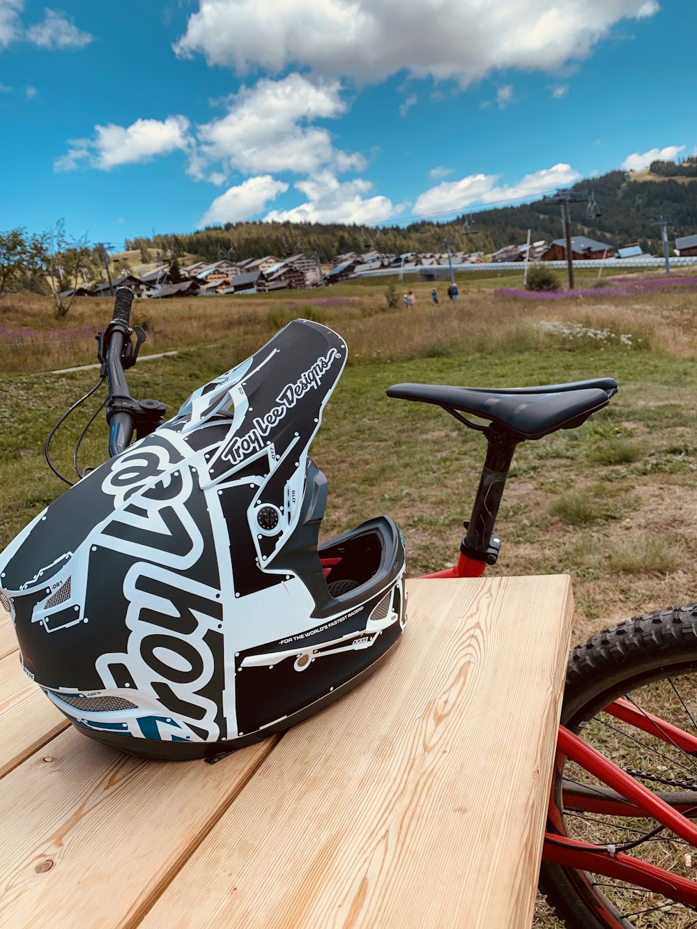 a helmet sitting on top of a wooden table