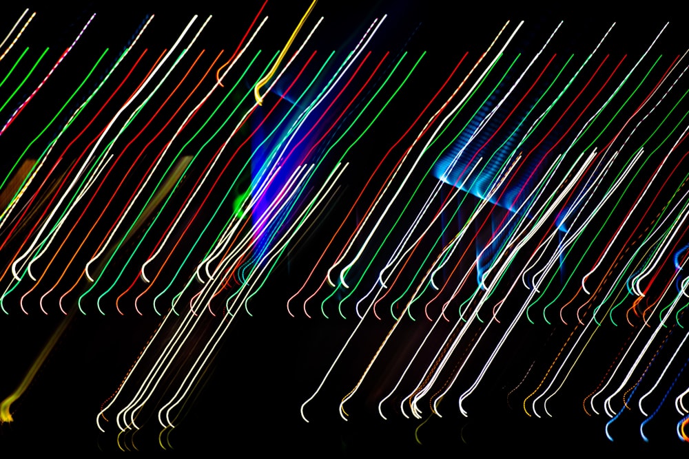 a group of multicolored lights in the dark