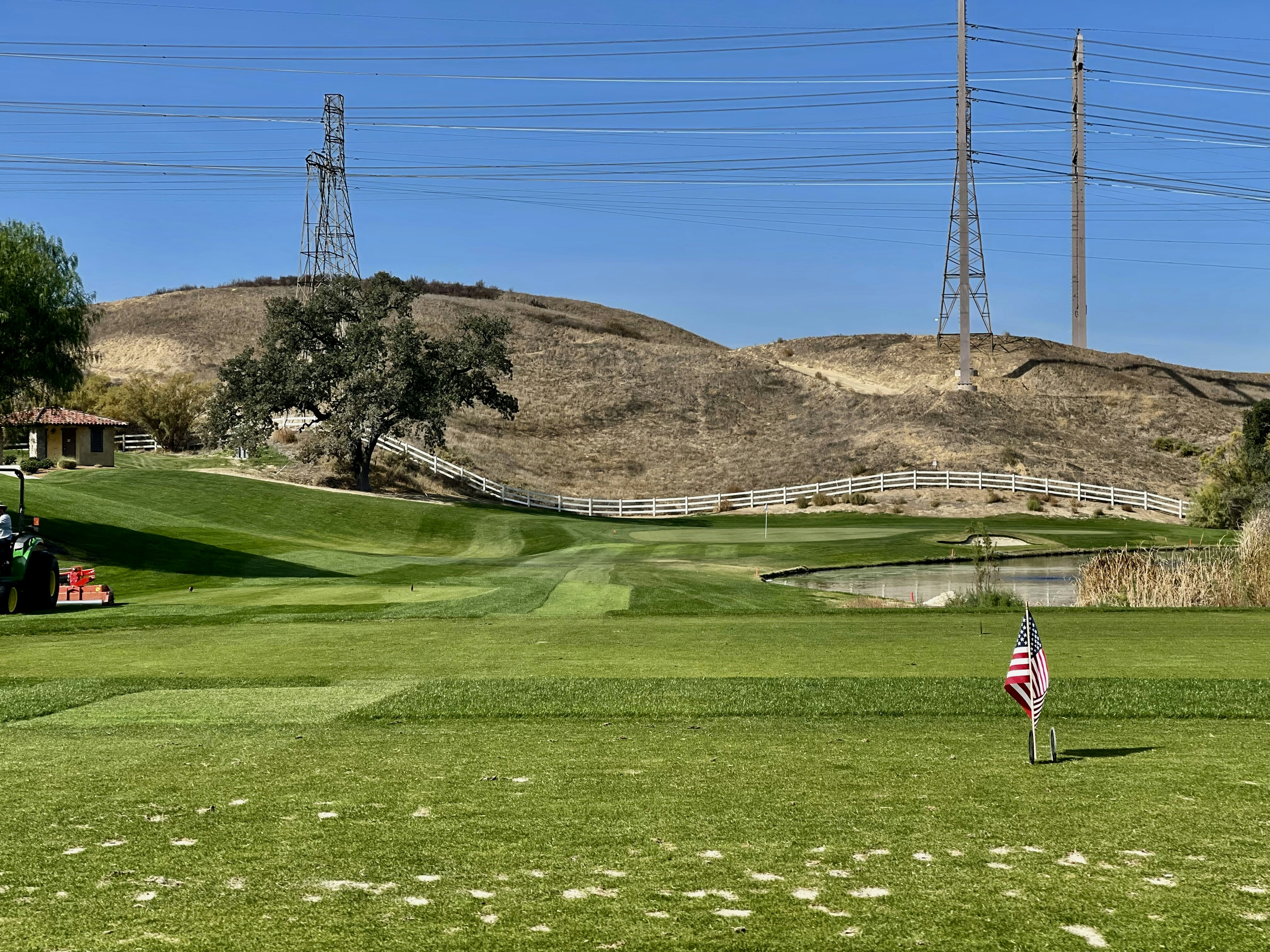 a golf course with a flag on the green