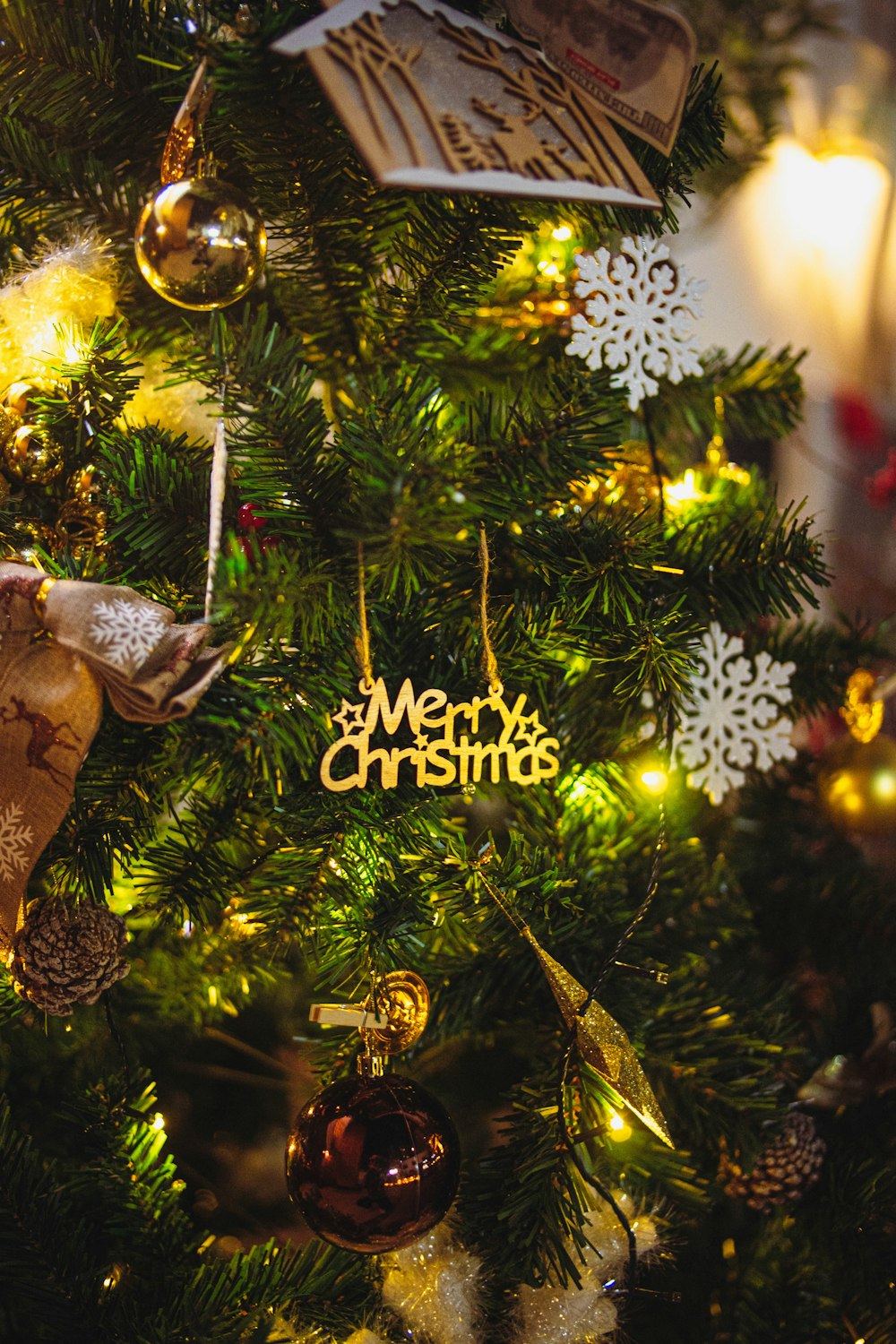 a close up of a christmas tree with ornaments