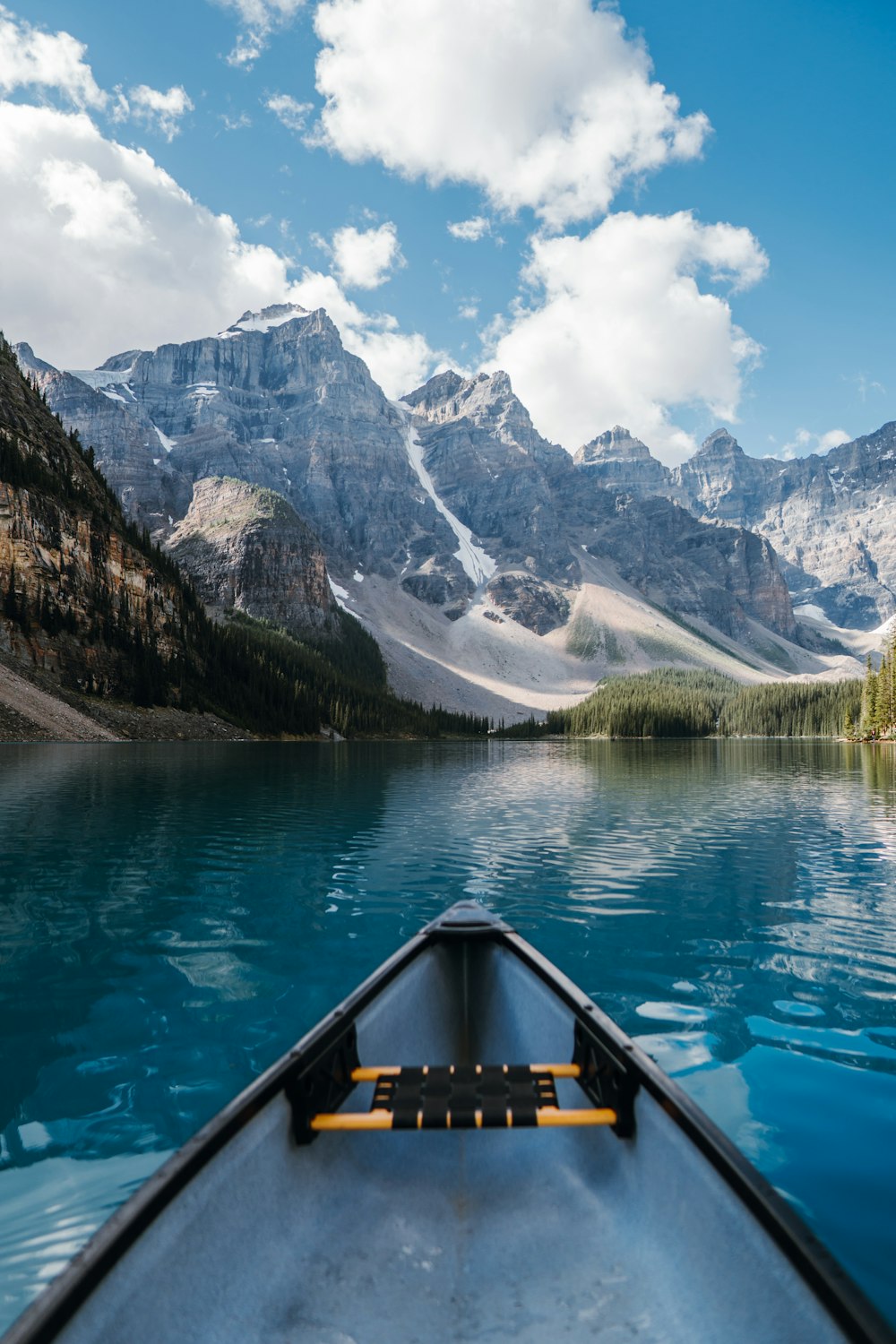 a view of a mountain lake from a canoe