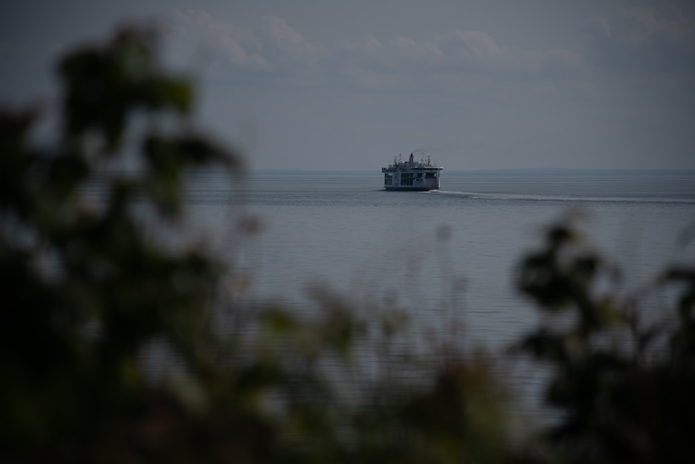 a boat is out in the ocean on a foggy day