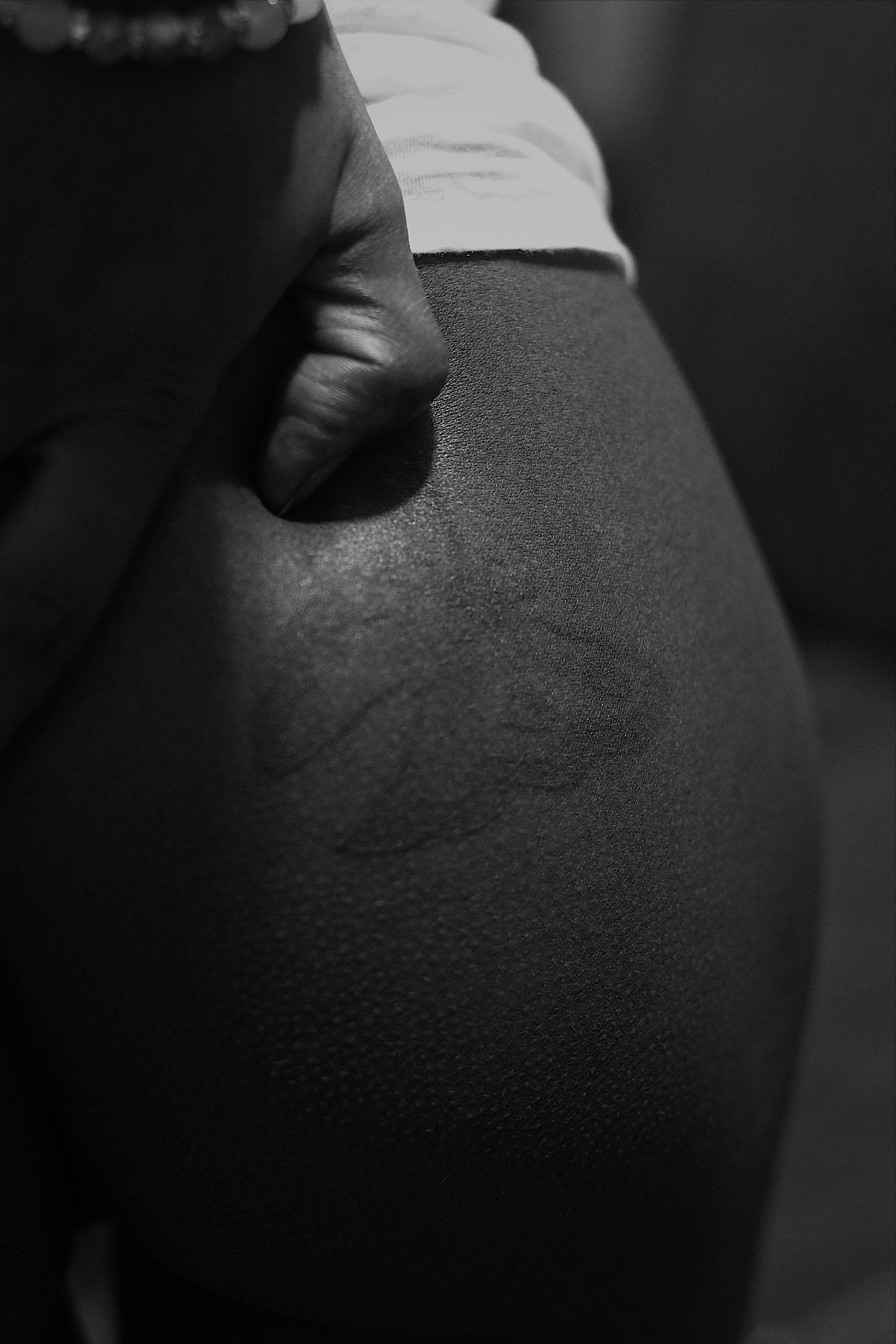 a close up of a person's butt and hand