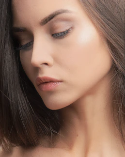 a close up of a woman with her eyes closed