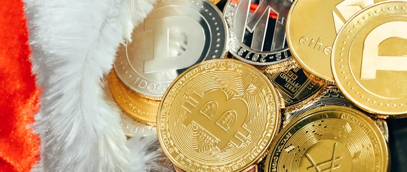 a pile of bitcoins with a santa hat on top of it