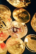 a pile of gold and silver coins sitting on top of each other