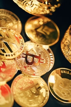 a pile of gold and silver coins sitting on top of each other