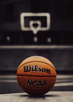 a close up of a basketball on a court