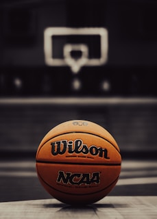 a close up of a basketball on a court