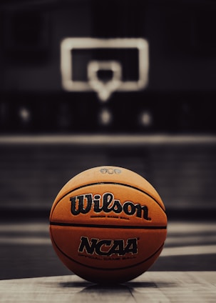a close up of a basketball on a court