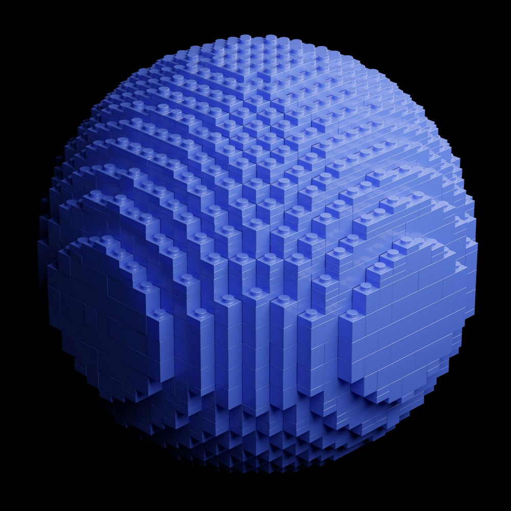 a blue ball made out of legos on a black background