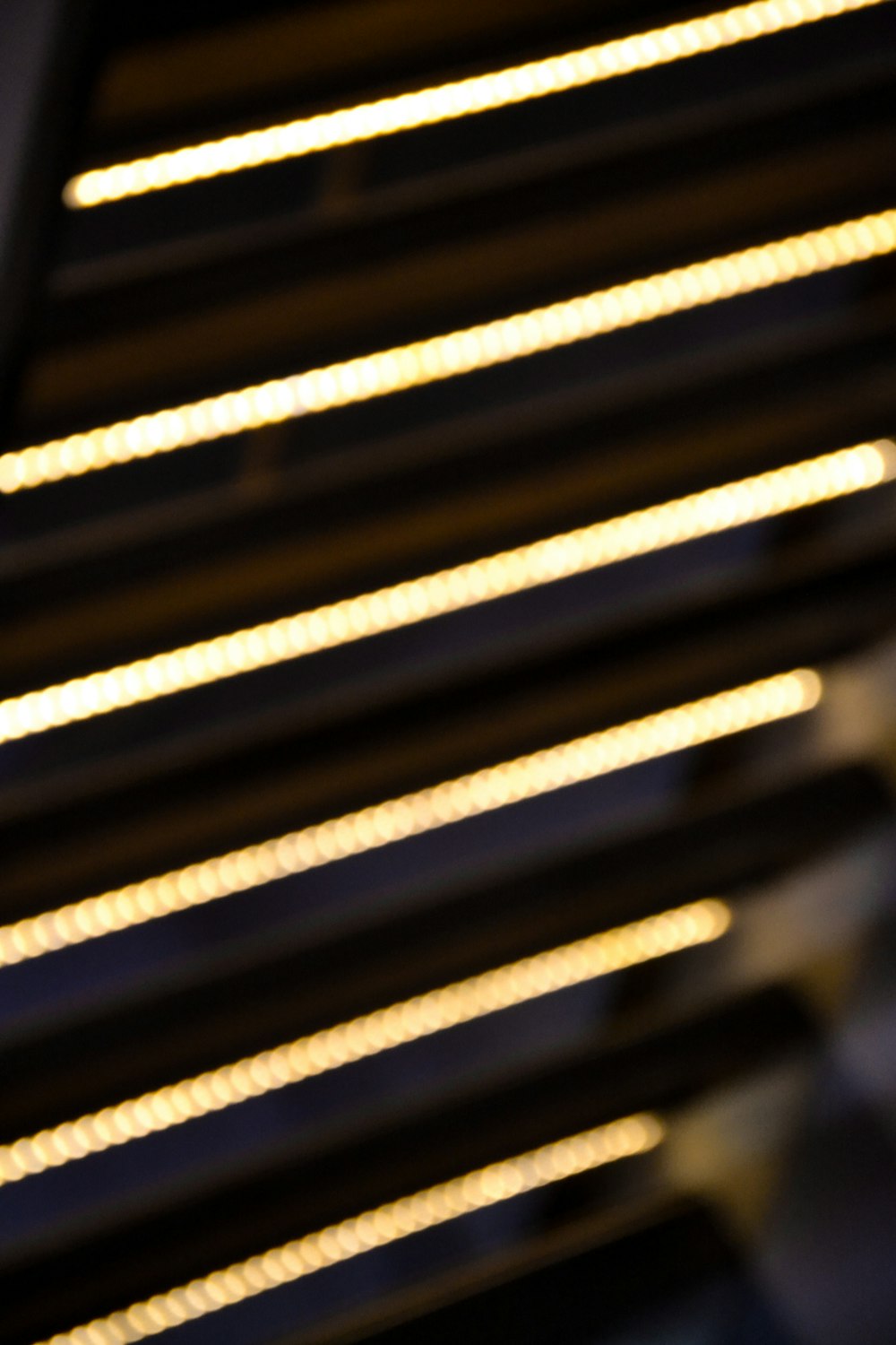 a close up of a metal grill with lights on it