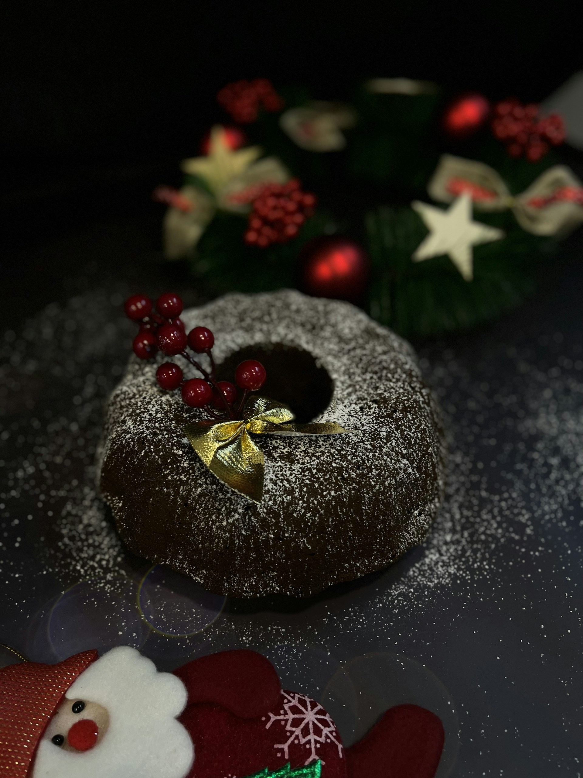 a chocolate bundt cake with a christmas decoration