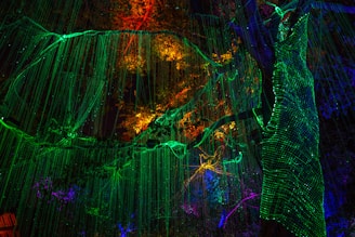 Close-up of a glowing procedural tree with intricate algorithmic patterns in a dark space.