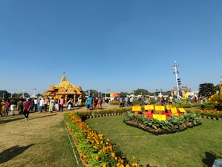 A serene spiritual gathering at Shri Arvind Society with natural greenery in the background.
