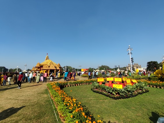 A serene spiritual gathering at Shri Arvind Society with natural greenery in the background.