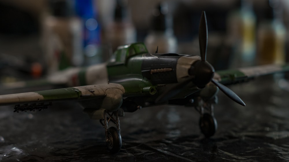 a toy airplane sitting on top of a table