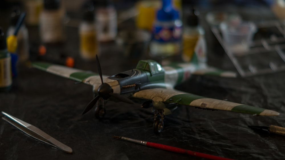 a toy airplane sitting on top of a table