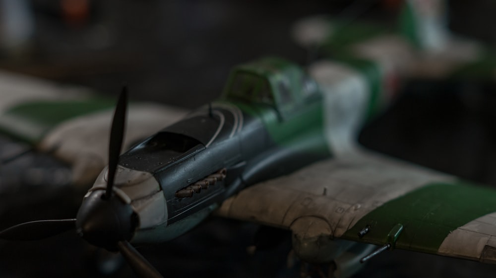 a close up of a toy airplane on a table