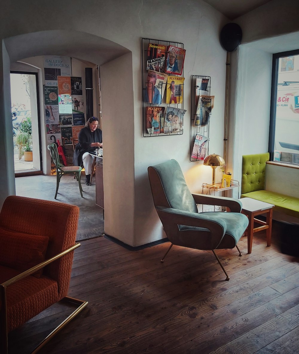 a man sitting in a chair in a living room