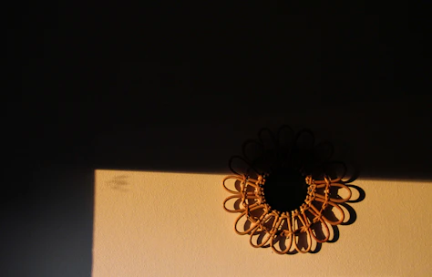 Guardian-inspired woven wall hanging illuminated by natural sunlight, showcasing intricate fiber details.
