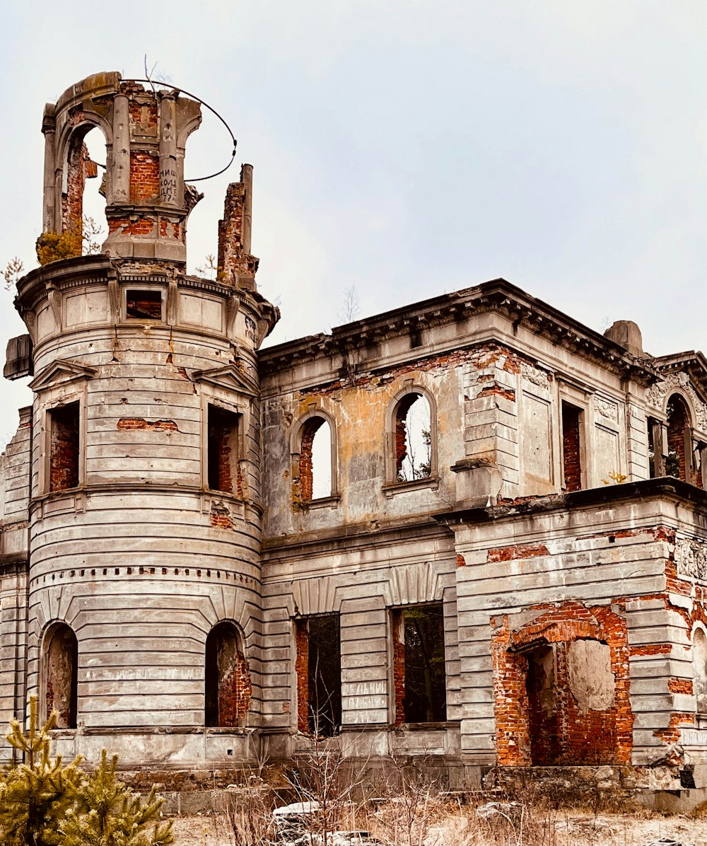 an old building with a clock on the top of it