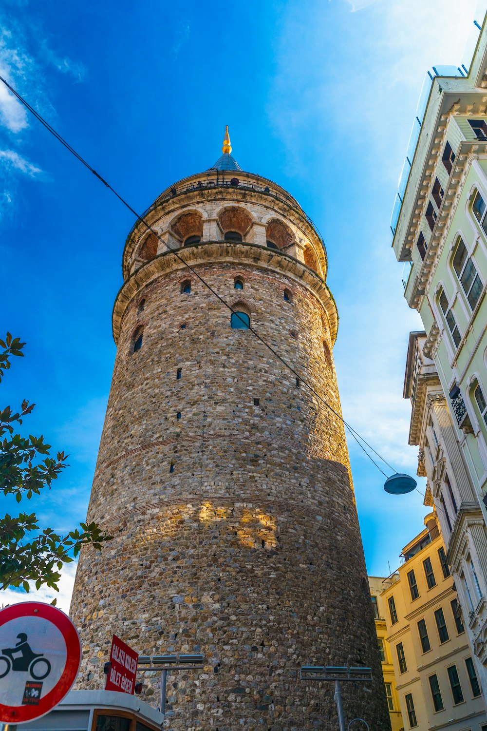 a tall brick tower sitting next to a tall building