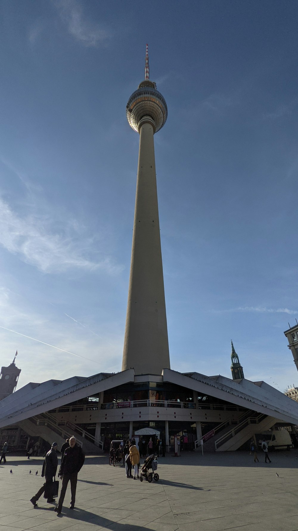 a very tall building with a very tall tower in the background