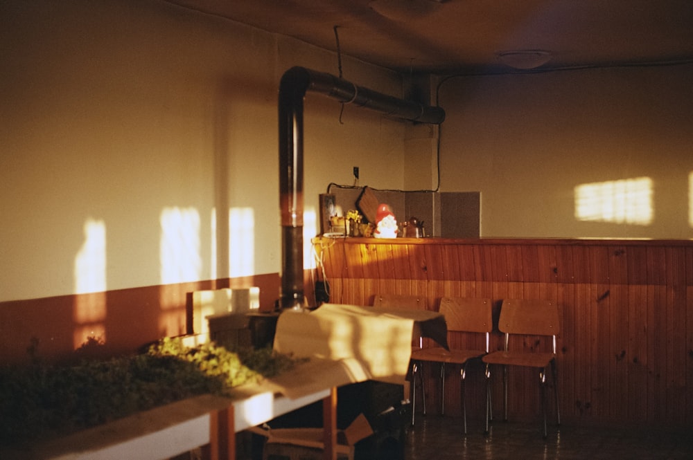 a room with a bunch of chairs and a table