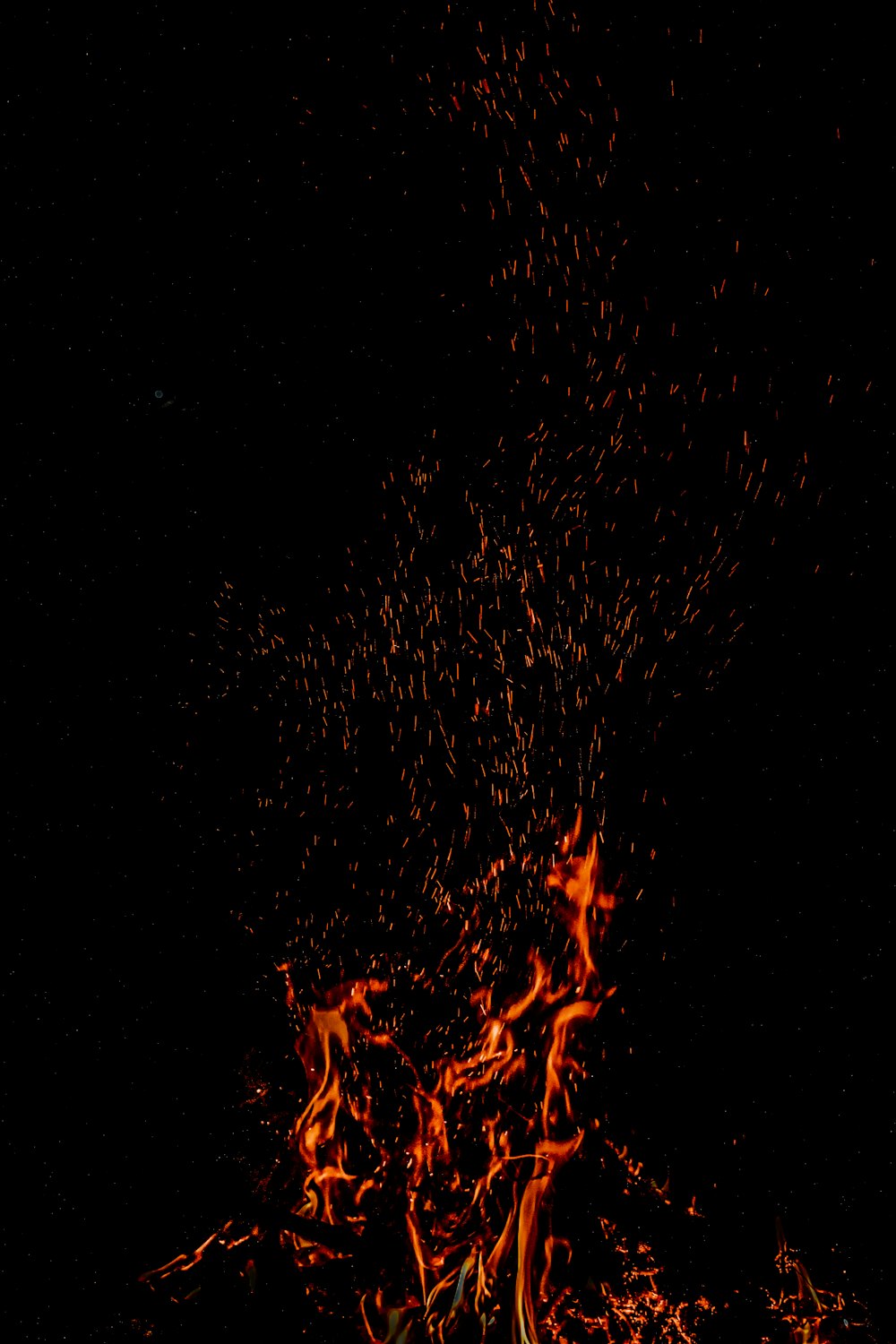 a close up of a fire in the dark