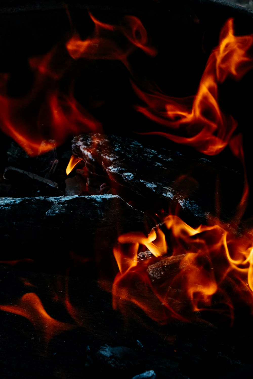 a close up of a fire burning in a grill