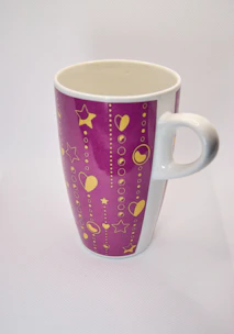 A close-up of a white and purple custom mug featuring the jl customized logo.