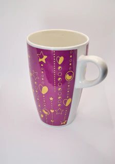 Quirky 80s style ceramic mug with playful retro motifs in primary colors