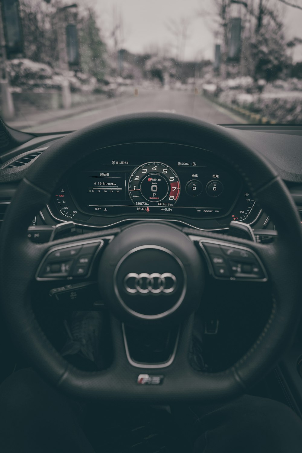 a steering wheel and dashboard of a car